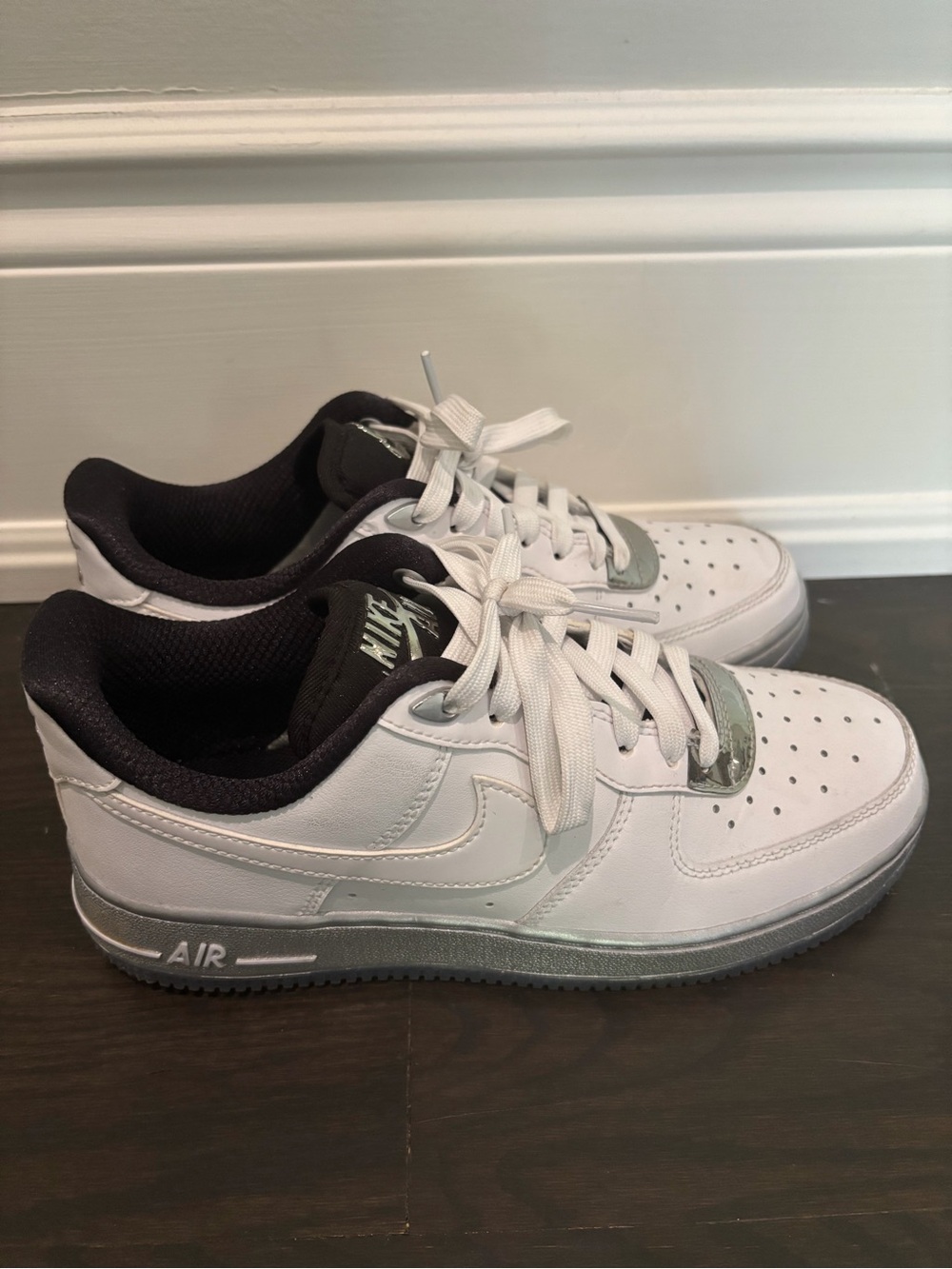 Nike Air Force 1 White Low-Top Sneakers with Black Liner and Silver Sole Accents